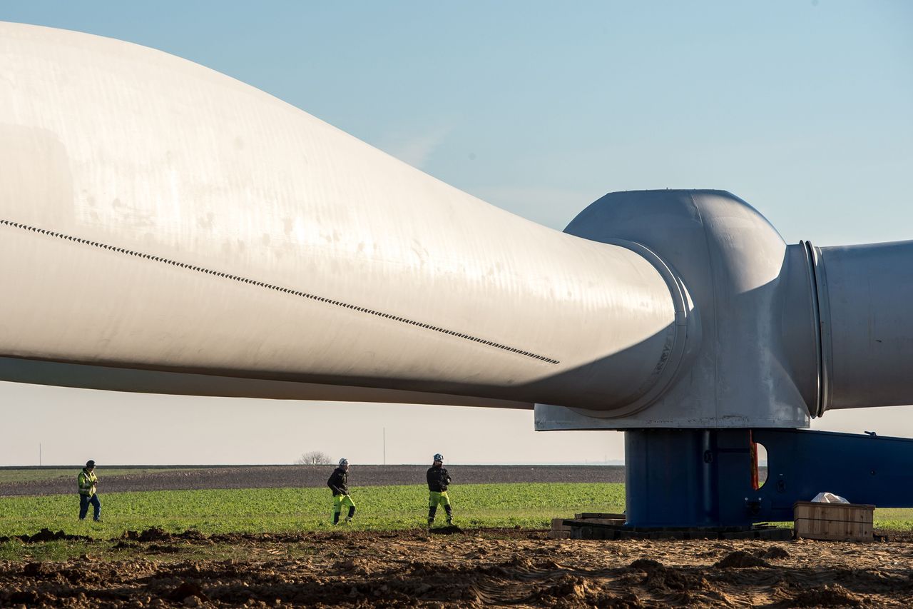 Workers install a wind turbine in Leury, northern France.
