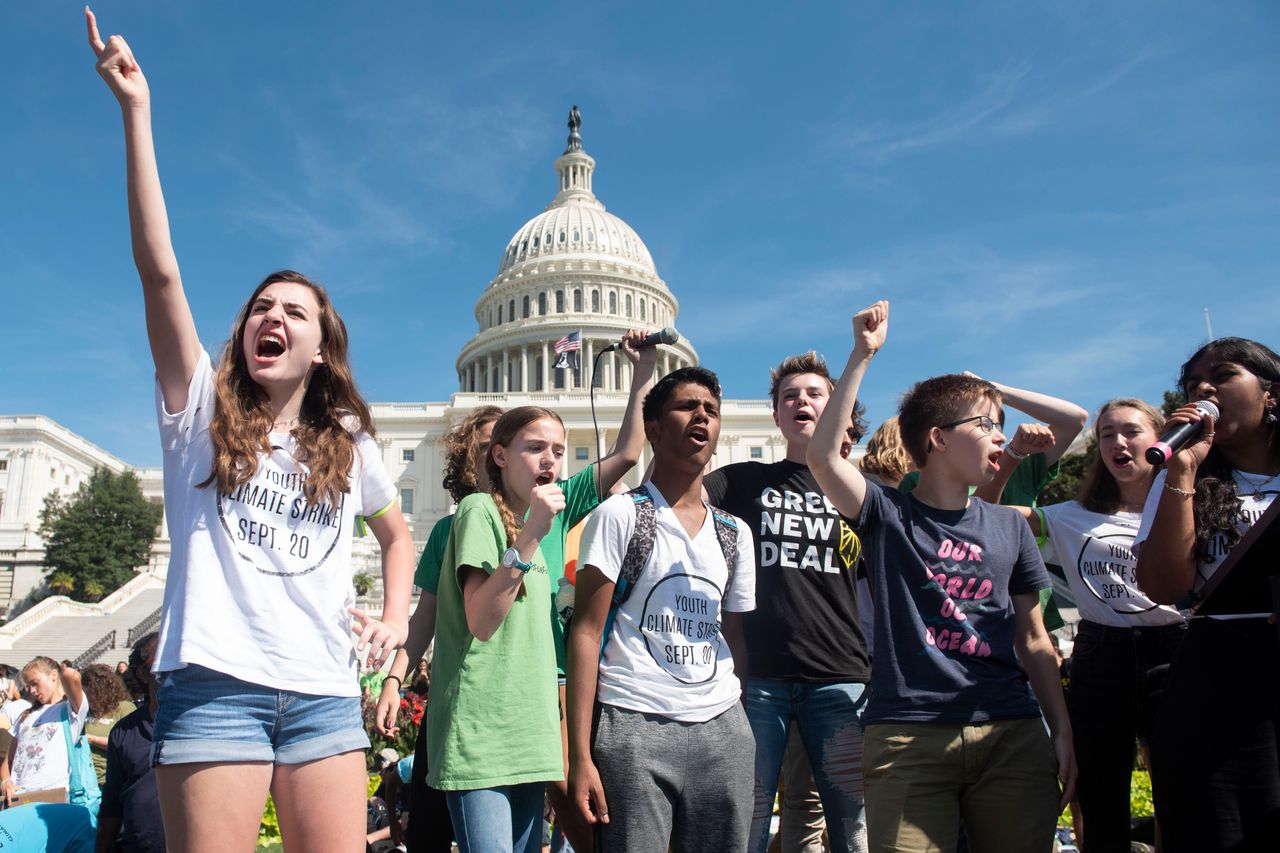 Young climate activists rally the crowd at the end of the Climate Strike protest on Sept. 20, 2019, in Washington D.C. 