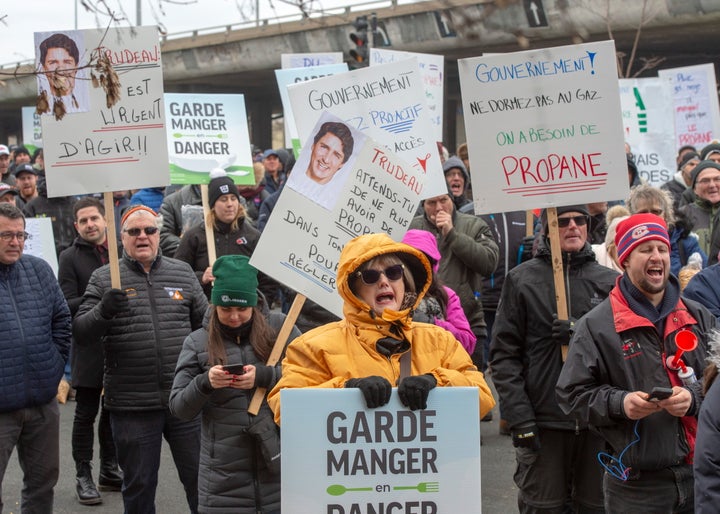 Farmers protest the ongoing CN Rail strike in front of the riding office of Prime Minister Justin Trudeau on Nov. 25, 2019 in Montreal.