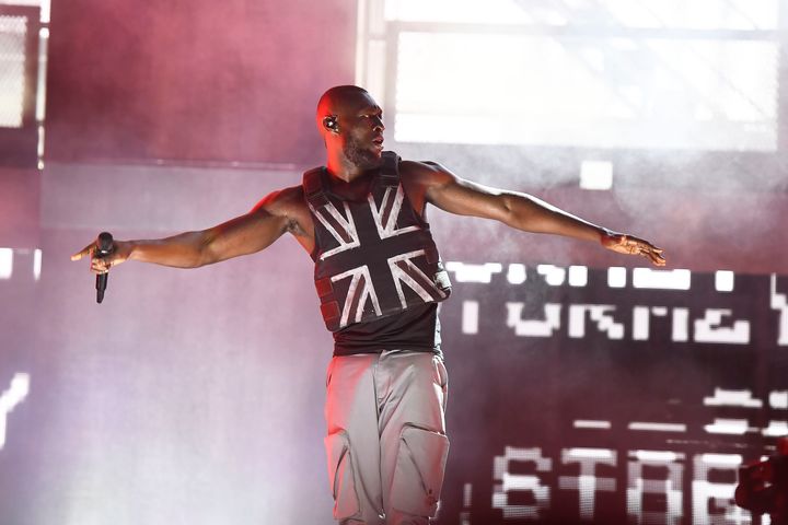 Stormzy in concert at Glastonbury Festival this year. The musician has urged fans to register to vote.