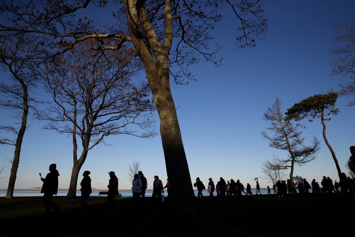 Marchers perform a Stomp Dance in Pilgrim Memorial State Park during the 48th National Day of Mourning on Nov 23, 2017.