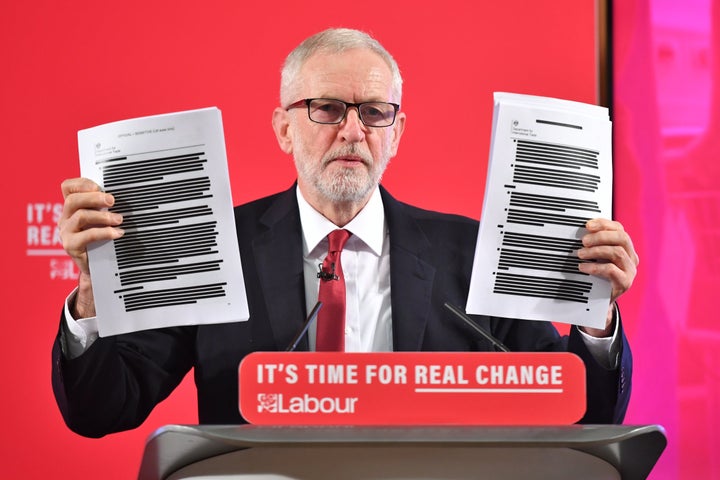 Labour leader Jeremy Corbyn holds a redacted copy of the Department for International Trade's UK-US Trade and Investment Working Group readout.