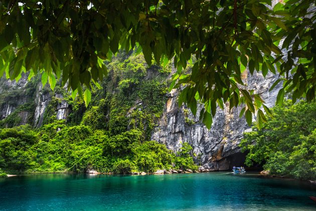 Clear river flowing from the cave in the National Park of Phong Nha, Vietnam.