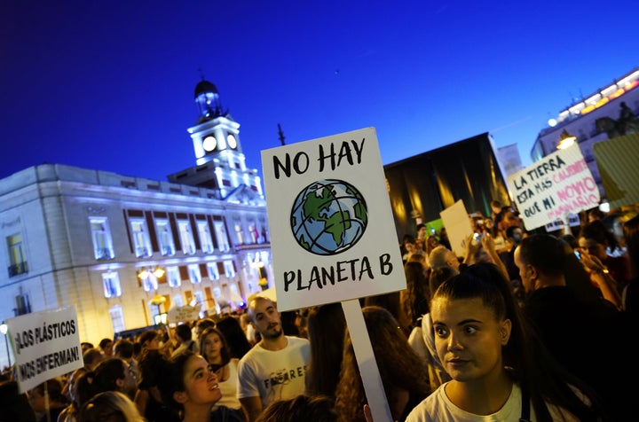 A woman holds a placard reading "There is no Planet B" during a protest demanding global politicians take urgent action to fight climate change in Madrid in September.