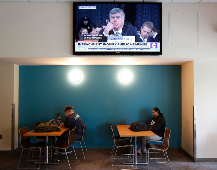 William Taylor, the top U.S. diplomat in the Ukraine, is seen testifying before the House Intelligence Committee on a television at California State University, Sacramento Wednesday, Nov. 13, 2019. 