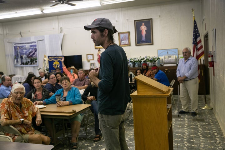 Scott Warren, a volunteer for the humanitarian aid organization No More Deaths, speaks at a community meeting to discuss fede