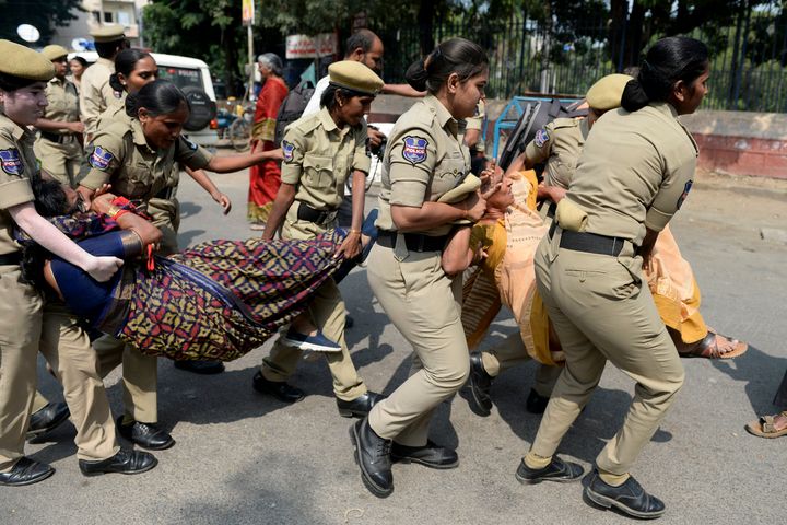 Police personnel detain activists during a protest against the state government's order to sack over 40,000 TSRTC employees in Hyderabad on November 7, 2019.