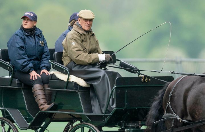 Prince Philip and Sophie, Countess of Wessex watch Lady Louise Windsor compete in the Private Driving Class during the Royal Windsor Horse Show in 2019
