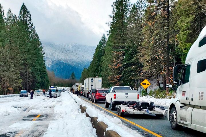 This photo provided by Caltrans shows cars and trucks in stopped traffic on Interstate 5 near Dunsmuir, Calif., on Nov. 27, 2019. 