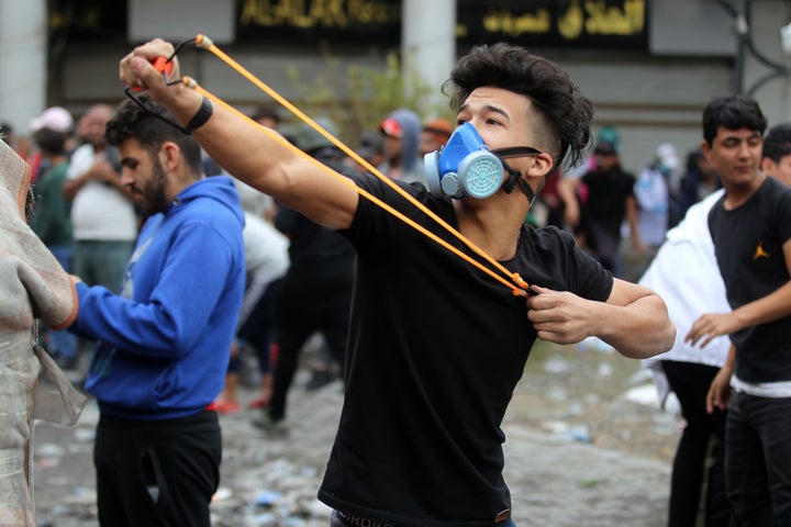 Iraqi protesters clash with Iraqi security forces in al-Rasheed Street during ongoing anti-government demonstrations against corruption on Nov. 28, 2019. 