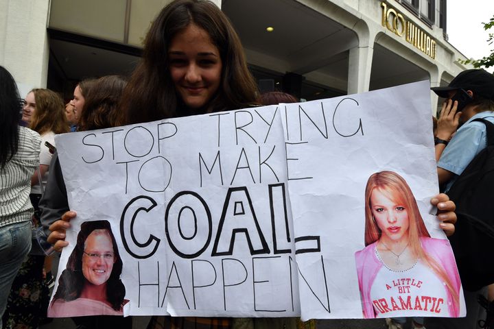 A student in Sydney holds up a placard during a rally calling for action on climate change.