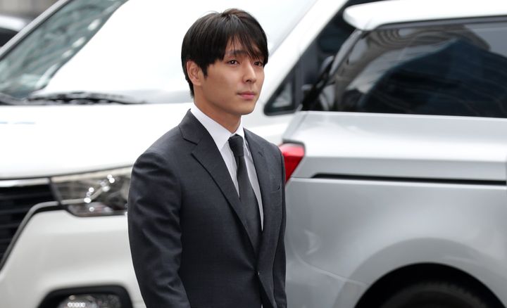 Choi Jong-Hoon, aka Jonghoon (Jong Hoon) former member of South Korean boy band FTisland is seen arriving at a Seoul police station for questioning over a sex video scandal among multiple celebrities on March 16, 2019 in Seoul.