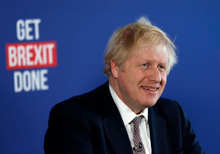 Britain's Prime Minister Boris Johnson smiles during a media conference