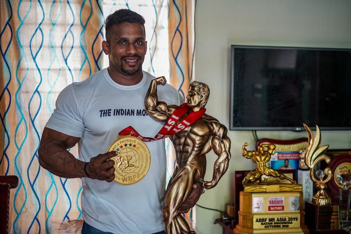 Chitharesh Natesan with his Mr Universe medal and trophy.
