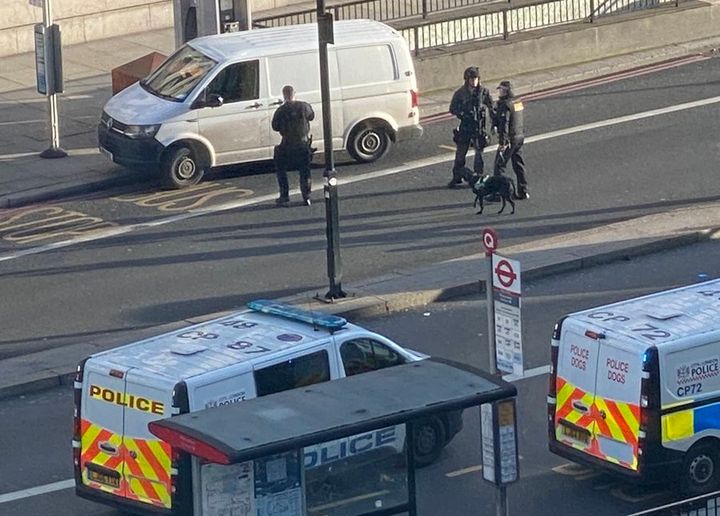 Sniffer dogs and police near a white van on London Bridge