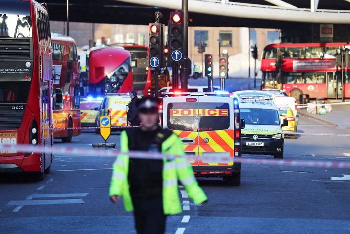 Police and emergency services respond to an incident on London Bridge in central London on Friday.