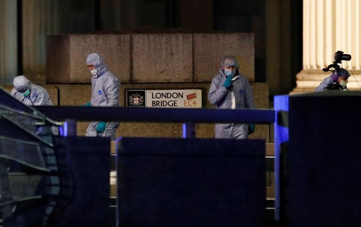 Forensics officers are seen near the site of an incident at London Bridge in London, Britain, November 29, 2019. REUTERS/Peter Nicholls