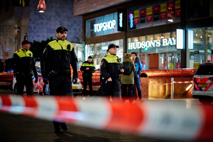 Dutch police secure a shopping street after a stabbing incident in the center of The Hague, Netherlands, Friday, Nov. 29, 201
