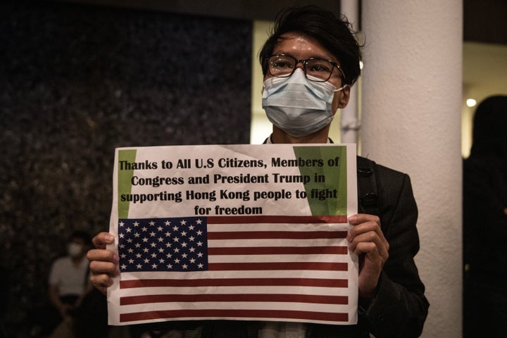 A pro-democracy protester holds a sign on Nov. 28 in Hong Kong.