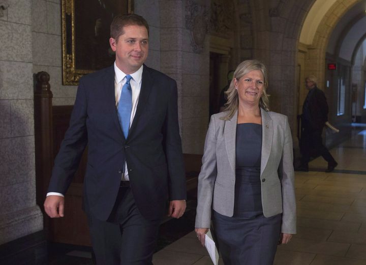Andrew Scheer walks with Leona Alleslev in Parliament Hill in Ottawa, on Sept. 17, 2018. 