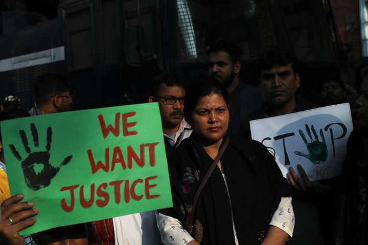 People hold placards and shout slogans as they take part in a protest against the alleged rape and murder of a 27-year-old woman on the outskirts of Hyderabad, in New Delhi,November 30, 2019. 