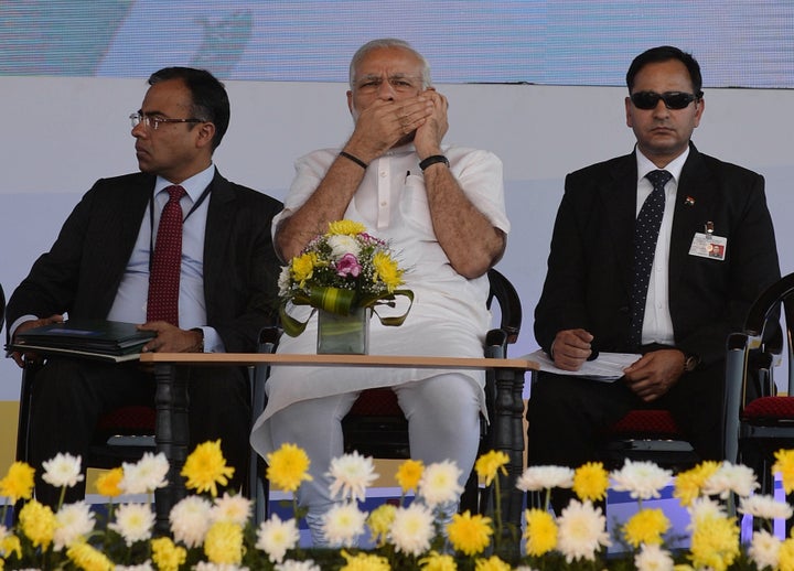 Prime Minister Narendra Modi speaks on a mobile phone on January 3, 2016. 