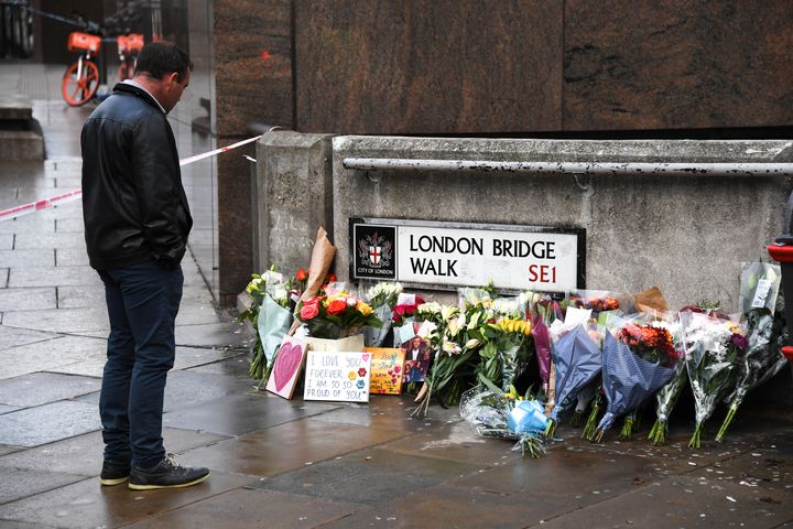 Flowers and a pictures are left in memory of the victims of the terror attack on London Bridge