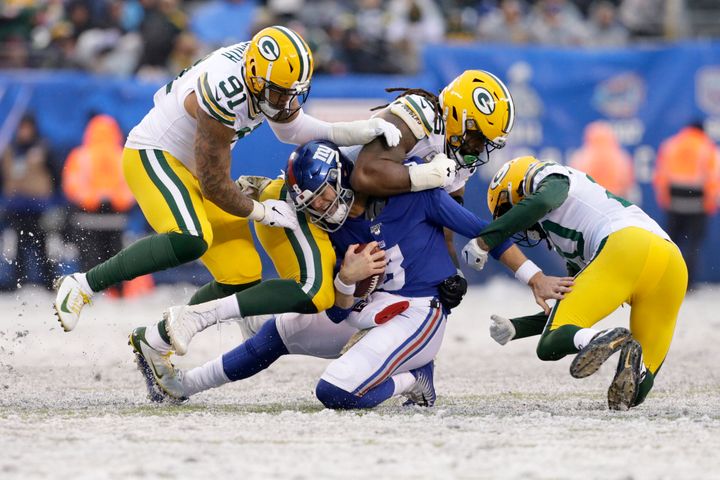 New York Giants quarterback Daniel Jones is sacked by Green Bay Packers defenders on Sunday.