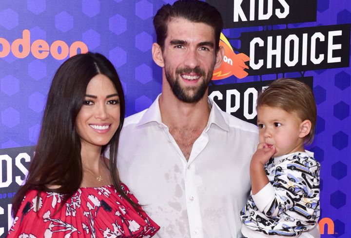 Michael Phelps and his wife, Nicole, attend Nickelodeon Kids' Choice Sports Awards with their son Boomer on July 19, 2018, in Santa Monica, California.