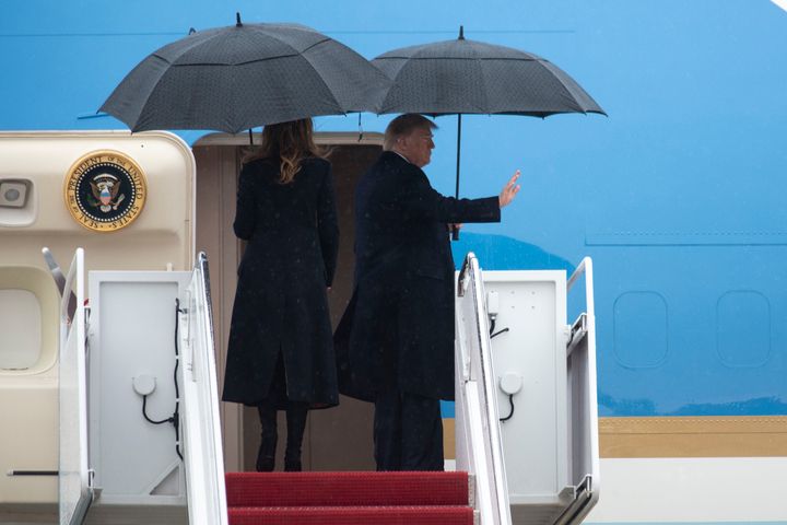 President Donald Trump and first lady Melania Trump board Air Force One