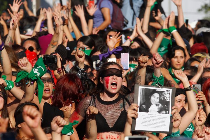 Women sing and perform during the demonstration and performance on November 29, 2019 in Santiago, Chile. 