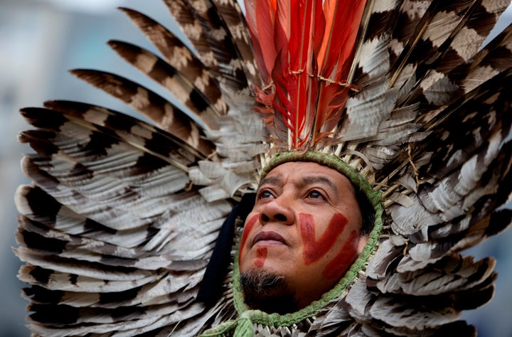 A Brazilian Indigenous leader protests against forest destruction in front of the European Union headquarters in Brussels on Nov. 5, 2019. Demonstrators demanded the EU and national leaders act to stop the forest destruction and related human rights abuses in the Amazon.