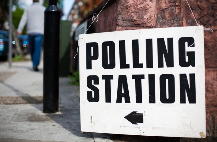 Directions to a polling station for a UK general election, European election or local election. Shallow depth of field.