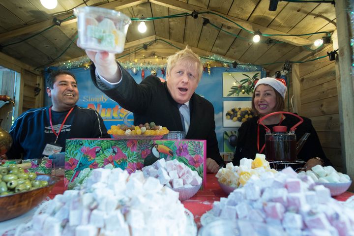 Johnson at a stall selling Turkish delight during a walkabout at Salisbury Christmas market