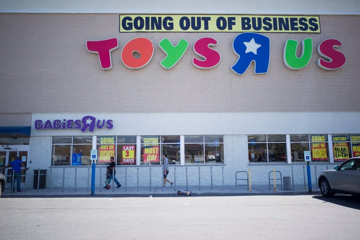 A Toys 'R' Us store in New York City advertises a clearance sale ahead of its closure in June 2018. The retailer's collapse put over 30,000 people out of work without severance benefits.