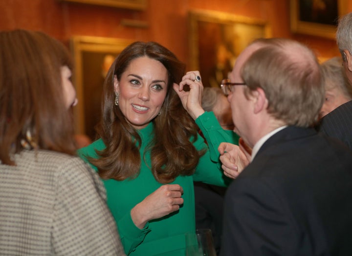 The Duchess of Cambridge greets guests at Buckingham Palace in central London on Dec. 3 during a reception hosted by Queen Elizabeth II ahead of the NATO alliance summit.