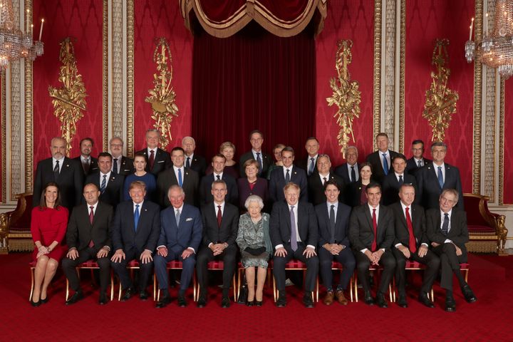 Leaders of NATO alliance countries, and its secretary general, join Britain's Queen Elizabeth and the Prince of Wales for a group picture during the reception. 