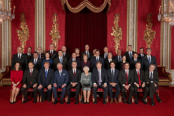 Leaders of NATO alliance countries, and its secretary general, join Britain's Queen Elizabeth and the Prince of Wales for a group picture during the reception. 