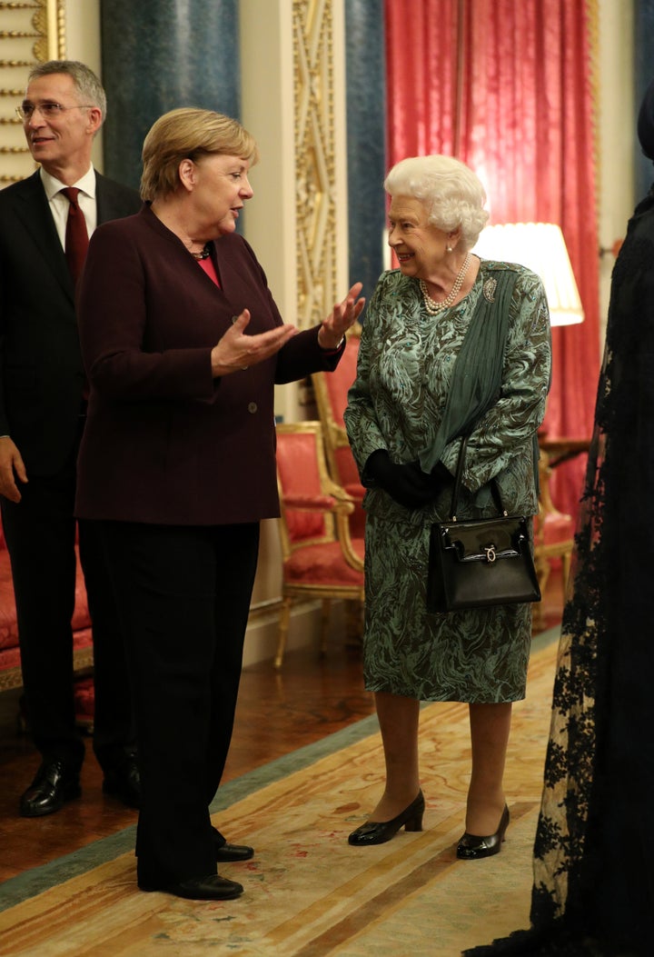 Queen Elizabeth talks with German Chancellor Angela Merkel. 