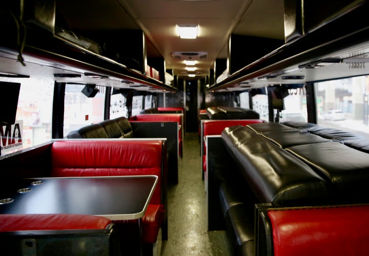 The refurbished bus features TVs, a kitchenette, washroom and fold out bunkbeds.