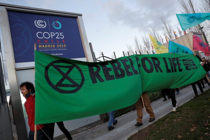 Members of the Extinction Rebellion group stage a protest Monday outside the venue of the United Nations climate change conference in Madrid.