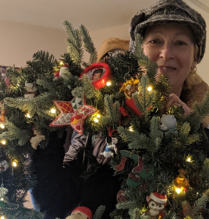 Janice holding the Christmas wreath she made for her son. 