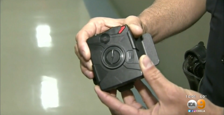 The officer's body camera, a similar one pictured, was designed to automatically record and save footage made two minutes bef