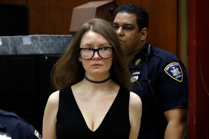 Anna Sorokin arrives in New York State Supreme Court on March 27, 2019, wearing her signature choker and V-neck dress.