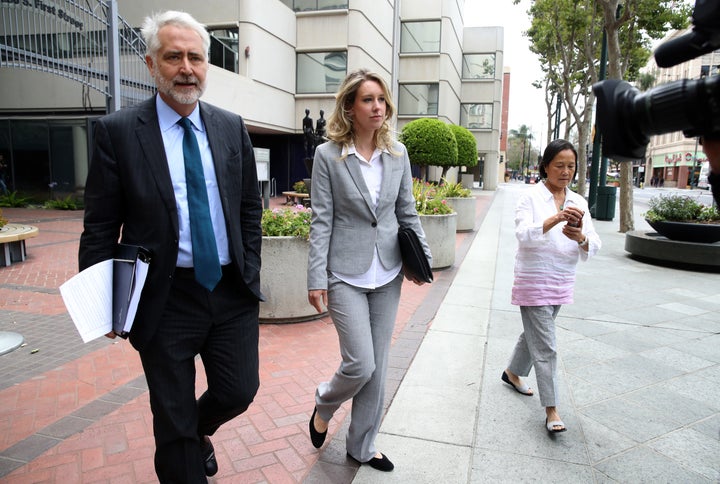 Elizabeth Holmes leaves U.S. Federal Court on June 28, 2019, in a gray suit.