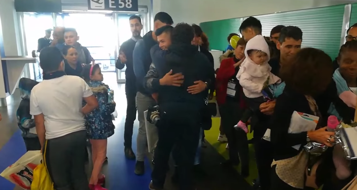 Thirty-three migrants are greeted by Catholic volunteers at Rome's Fiumicino Airport on Wednesday, Dec. 4, 2019.