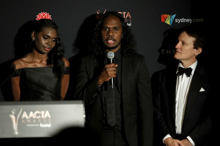 SYDNEY, AUSTRALIA - DECEMBER 04: (L-R) Magnolia Maymuru, Baykali Ganambarr and Damon Herriman speak in the media room after winning the AACTA Award for Best Film during 2019 AACTA Awards Presented by Foxtel at The Star on December 04, 2019 in Sydney, Australia. (Photo by Rocket K/Getty Images for AFI)