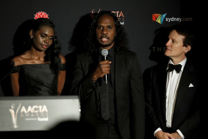 SYDNEY, AUSTRALIA - DECEMBER 04: (L-R) Magnolia Maymuru, Baykali Ganambarr and Damon Herriman speak in the media room after winning the AACTA Award for Best Film during 2019 AACTA Awards Presented by Foxtel at The Star on December 04, 2019 in Sydney, Australia. (Photo by Rocket K/Getty Images for AFI)