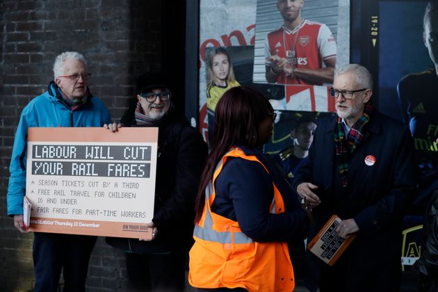 Jeremy Corbyn speaks to an Underground worker outside Finsbury Park station