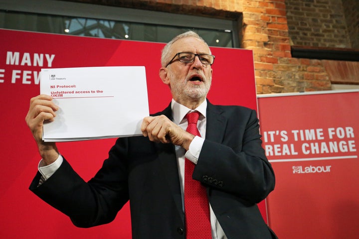 Labour Party leader Jeremy Corbyn holds up a leaked document relating to Northern Ireland, during a press conference in central London, whilst on the General Election campaign trail.